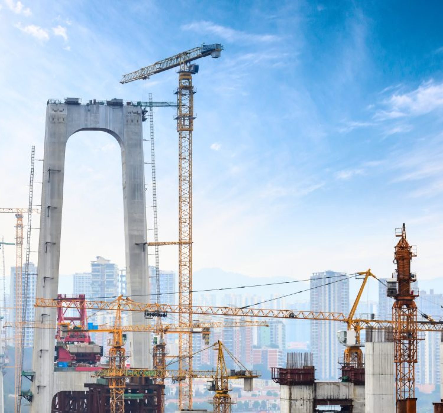 Construction of tall concrete pylon of bridge using tower crane